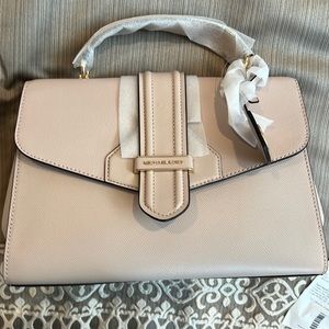 Michael Kors white pink pocketbook aproximately 12 x 9. Brand new with tags